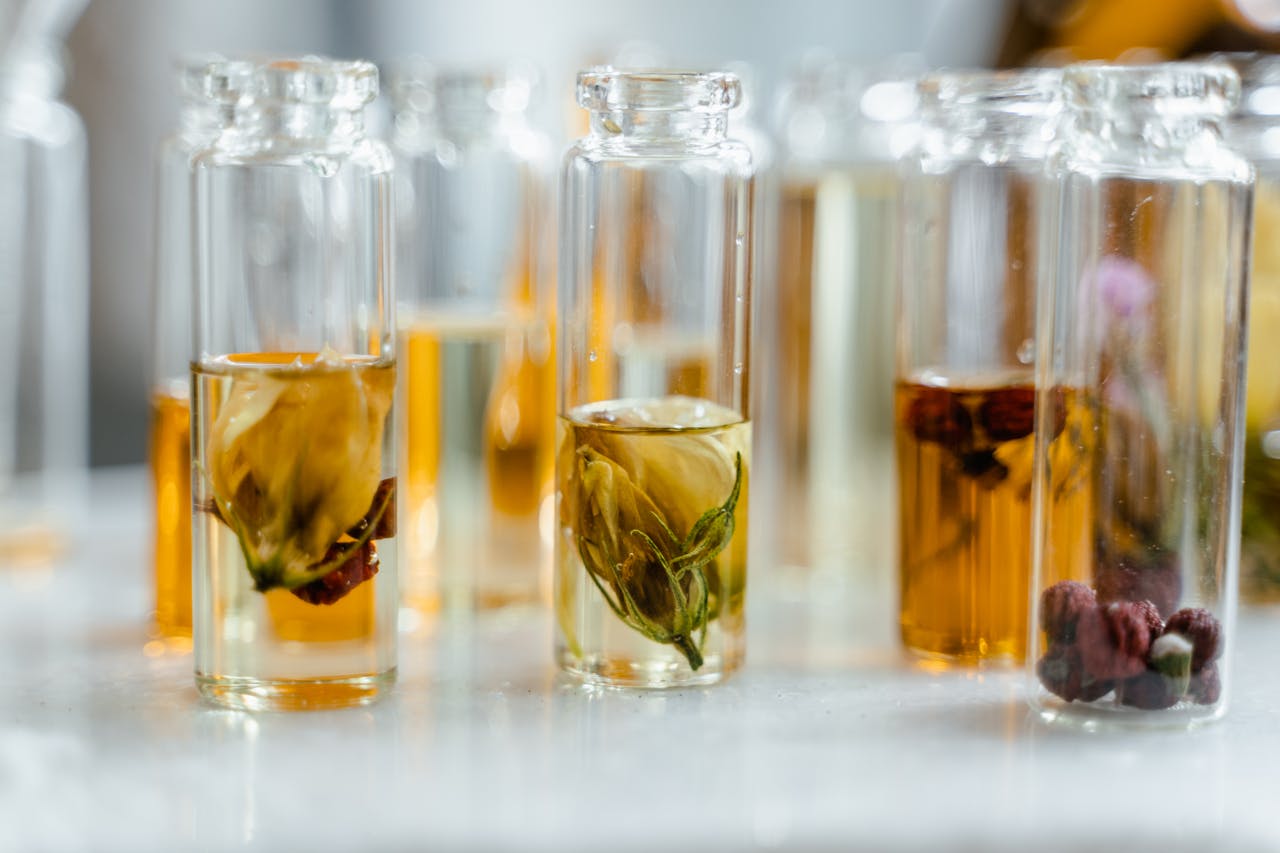services-img Glass bottles with floral infusions perfect for natural aromatherapy and skincare.